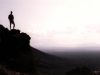 man_stands_tuscon_arizona_mountain